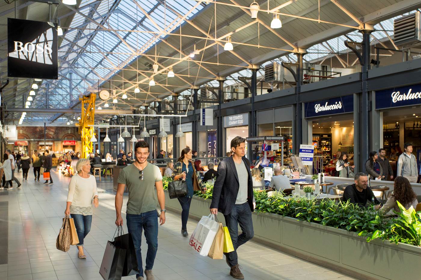 Swindon Designer Outlet Village interior with glass roof, shops and dining